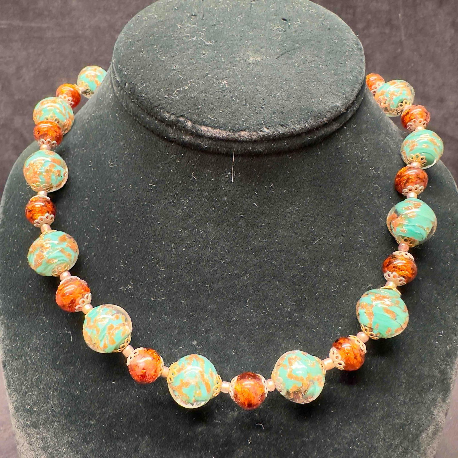 Venetian Murano Glass Lamp Work Aqua Green Round Bead Copper Brown Accents Beaded Necklace B13: Venetian Murano Glass Lamp Work Aqua Green Round Bead Copper Brown Accents Beaded Necklace B13. Necklace with aqua green glass beads with beautiful designs on each. The necklace features copper and br