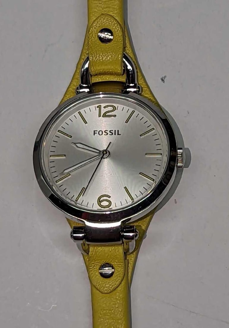 Fossil Georgia Stainless Steel Ladies Watch: Fossil Georgia Stainless Steel Ladies Watch. Comes in a box (not the original) that is approx 9 3/4" x 1" x 2" and it weighs 0.28lb. The watch requires a new battery. Movement: Quartz Wat