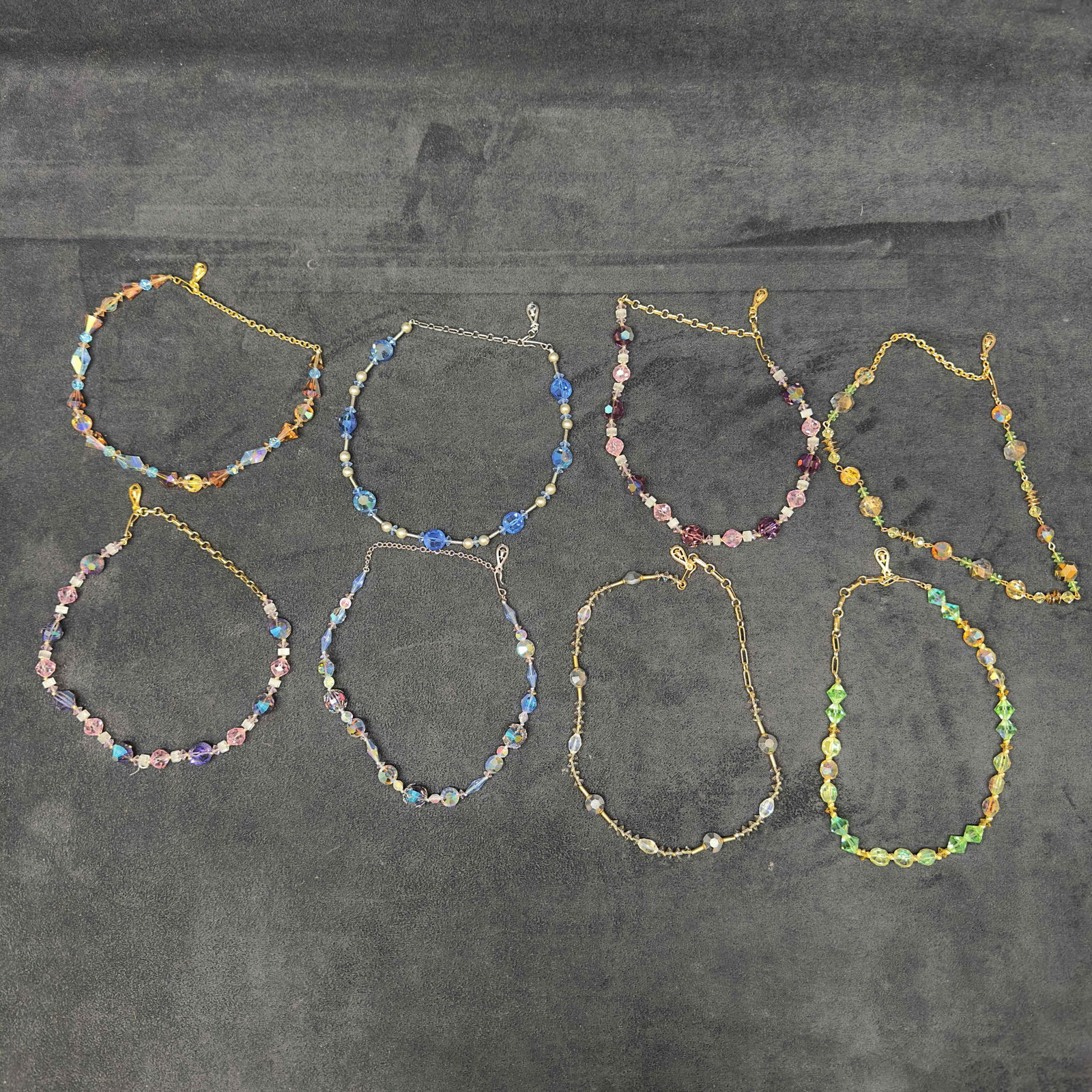 Coro Glass Beaded Necklace Set Lot of Eight Necklaces H80: Coro Glass Beaded Necklace Set Lot of Eight Necklaces H80. Necklaces with multi colored glass beads with beautiful designs. The necklaces feature a j hook clasp closure. Gold and silver toned accents
