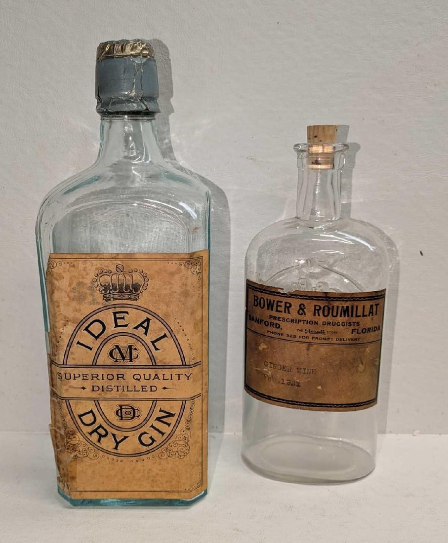 Ideal Superior Quality Distilled Dry Gin & Ginger Wine Bottles: Ideal Superior Quality Distilled Dry Gin & Ginger Wine Bottles. This lot includes: (1) Ideal Superior Quality Distilled Dry Gin Glass Bottle. This empty bottle is approx 3 1/4" x 3" x 9 3/