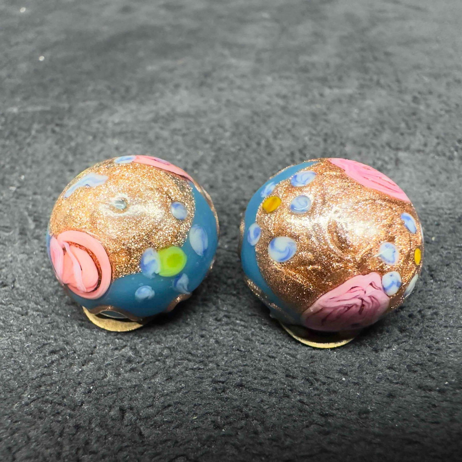 Murano Venetian Art Glass Lamp Work Blue Floral Copper Accents Circle Bead Earrings D10: Murano Venetian Art Glass Lamp Work Blue Floral Copper Accents Circle Bead Earrings D10. Earrings with blue glass beads with beautiful designs on each. The earrings feature copper colored and floral a