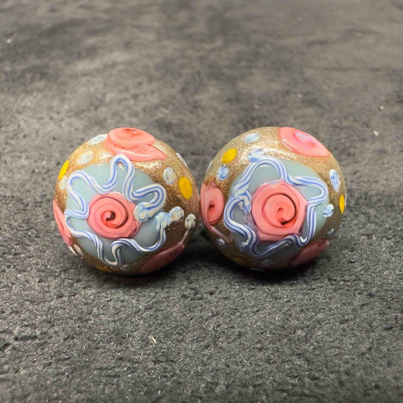 Murano Venetian Art Glass Lamp Work Light Blue Pink Floral Copper Accents Circle Bead Earrings D11: Murano Venetian Art Glass Lamp Work Light Blue Pink Floral Copper Accents Circle Bead Earrings D11. Earrings with light blue glass beads with beautiful designs on each. The earrings feature copper col