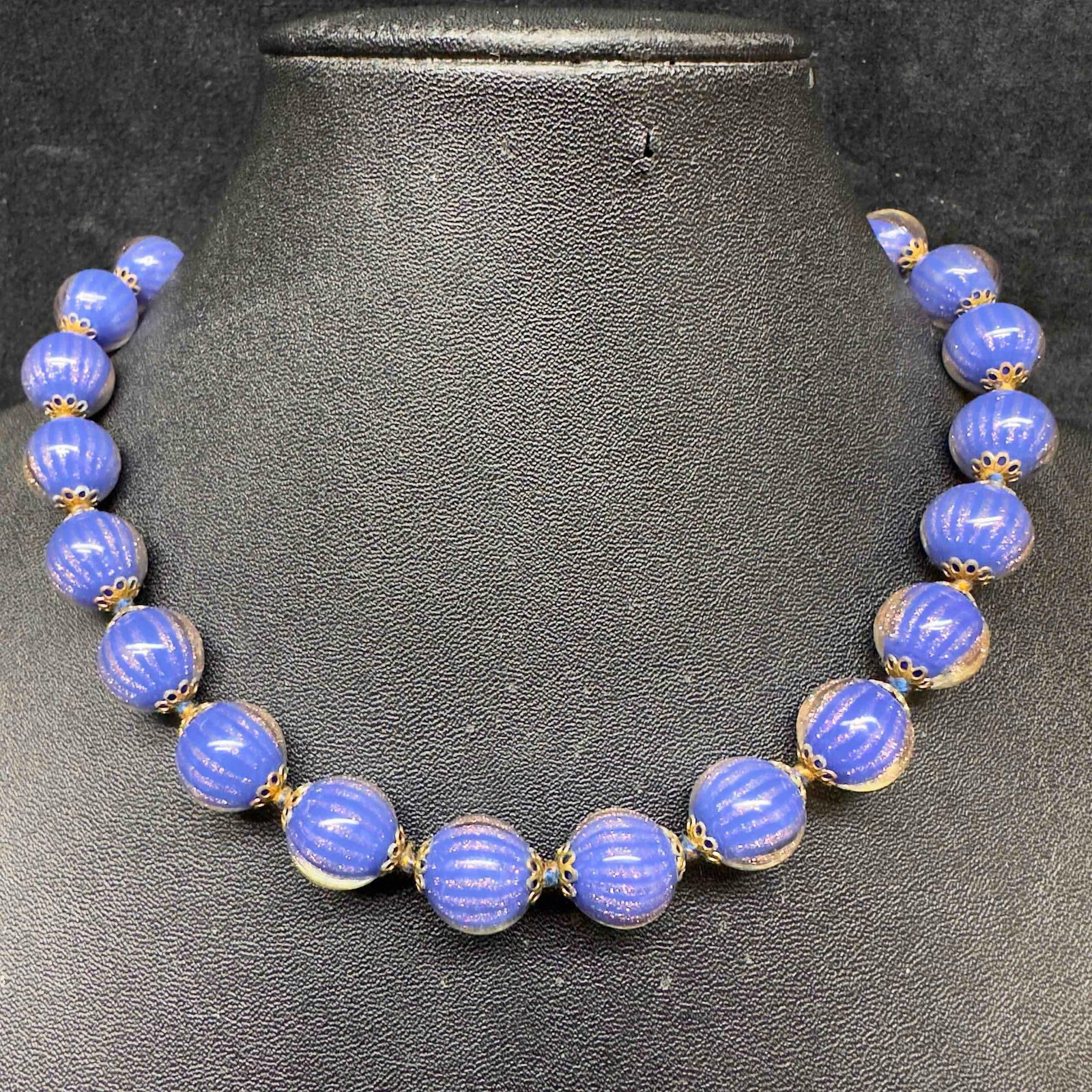 Venetian Murano Art Glass Lamp Work Dark Blue Bead Infused Copper Accent Beaded Necklace D8: Venetian Murano Art Glass Lamp Work Dark Blue Bead Infused Copper Accent Beaded Necklace D8. Necklace with dark blue colored glass beads with beautiful designs on each. The necklace features copper ac