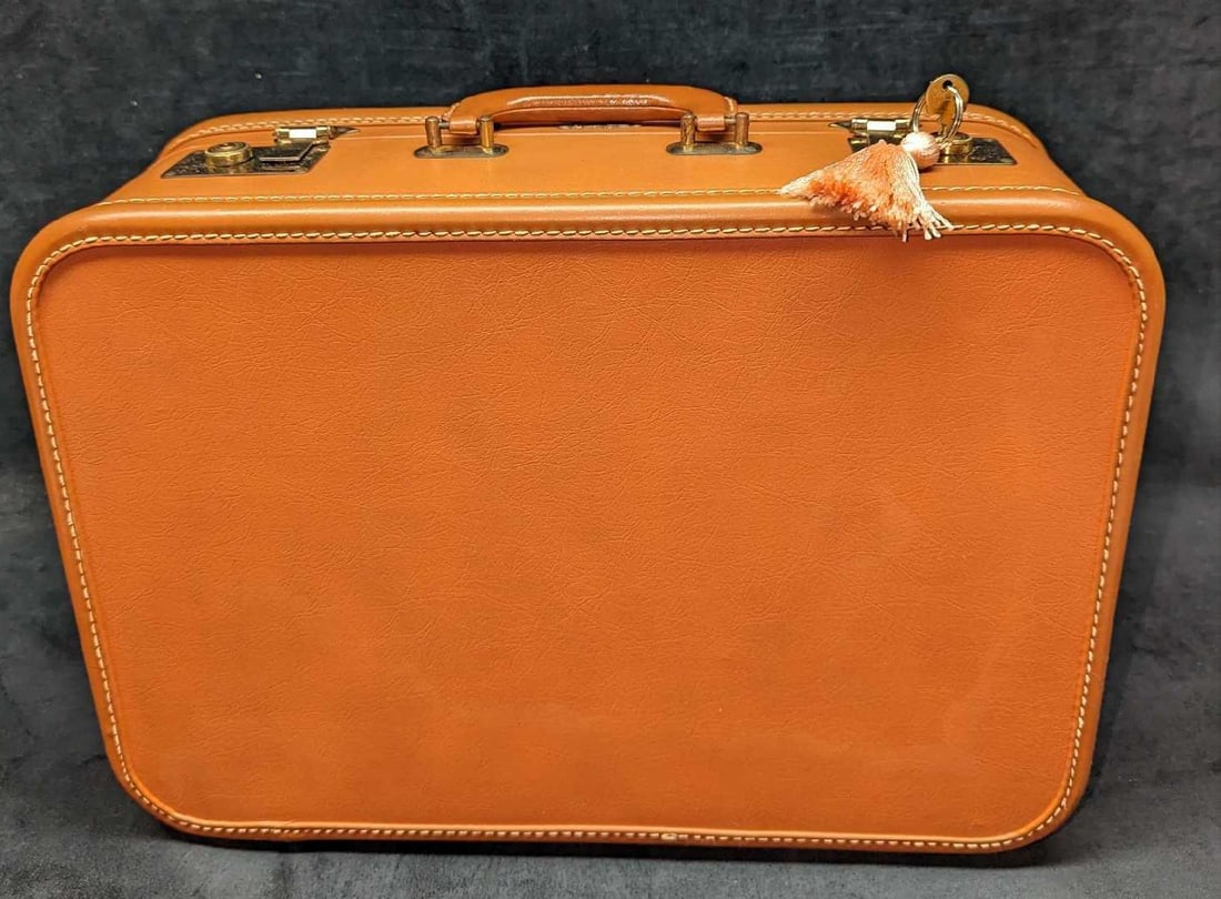 Vintage Superfortress Luggage A: Vintage Superfortress Luggage A. This is approx 18 1/4" x 6 1/8" x 13" and it weighs 5.22lbs. The handle is made of real leather, while the rest of the luggage appears to be vinyl. The brass hardware 