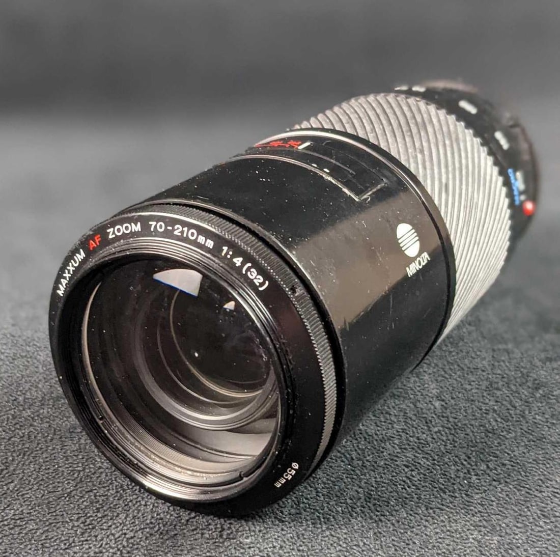 Minolta Maxxum AF 70-210mm 1:4 (32) Zoom Lens: The Maxxum AF 70-210mm lens is better made than many, with a metal barrel, focus ring, and filter threads. It focuses to 3.6 feet (1.1 meters) at every focal length, much closer than most other Tele-&