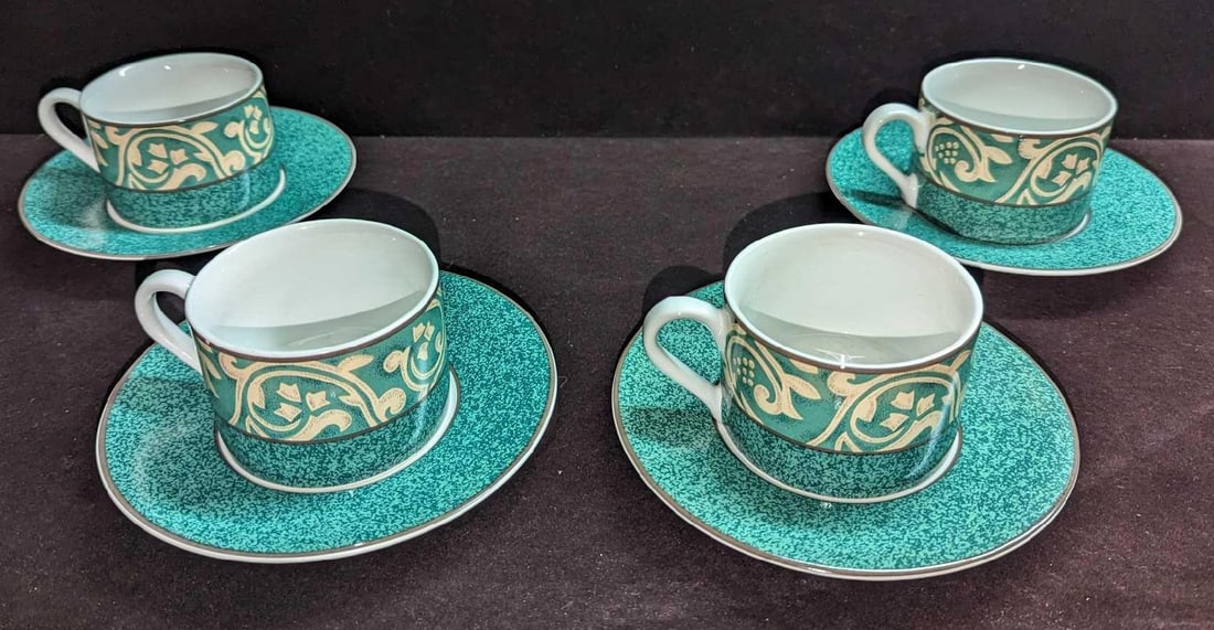 4 Retired Sango Pavilion Cups & Saucers A: 4 Retired Sango Pavilion Cups & Saucers A. The cups are approx 4 1/2" x 3 1/4" x 2 3/8". The saucers are approx 6 1/2" x 6 1/2" x 3/4". The total weight is 3.92 lbs. This series was released from the