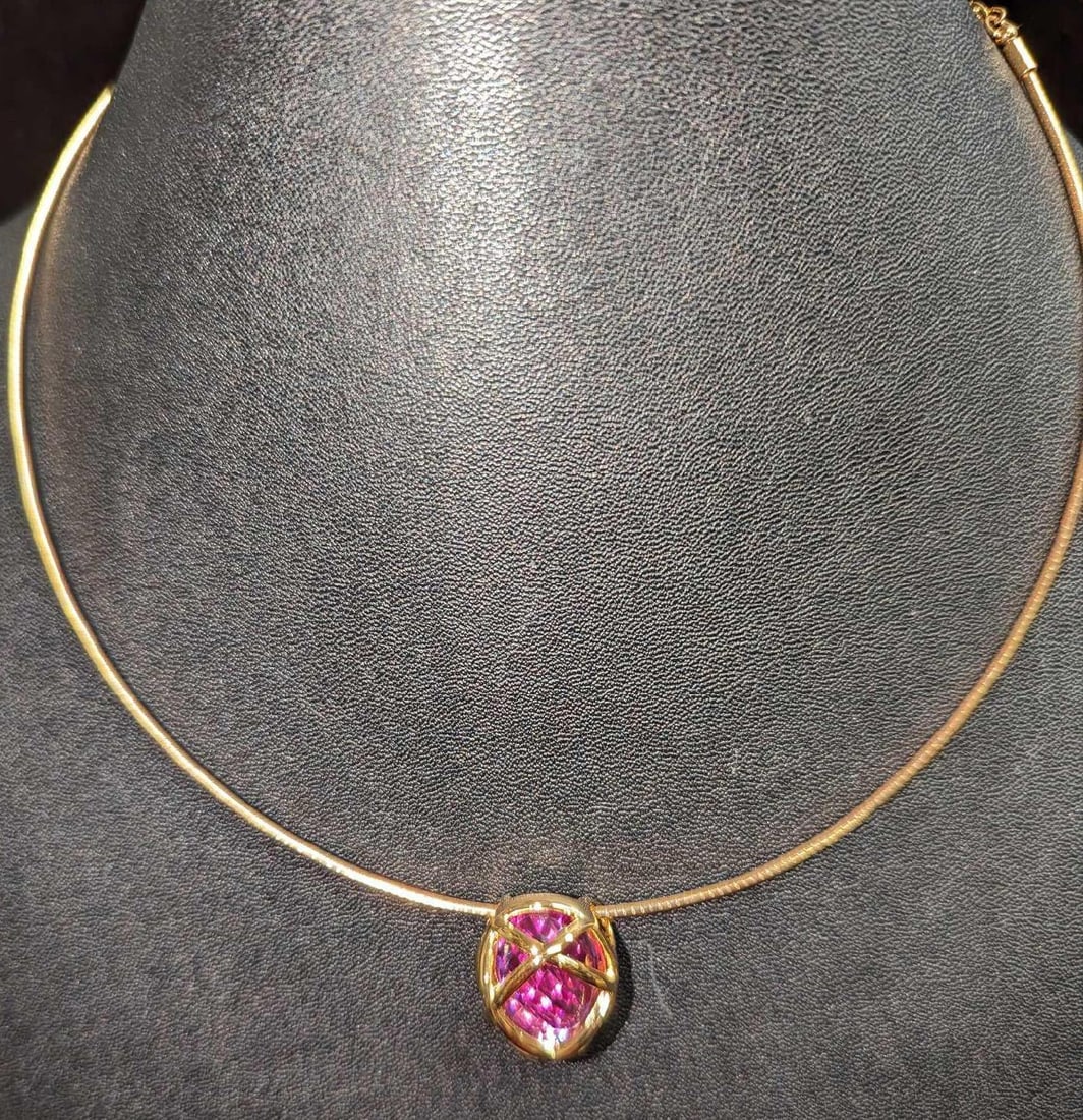 Joan Rivers Purple Gem Gold Tone Choker: Joan Rivers Purple Gem Gold Tone Choker. The hard-wired choker comes in a package that is approx 4" x 1/4" x 4 1/2" and it weighs 0.08lb.