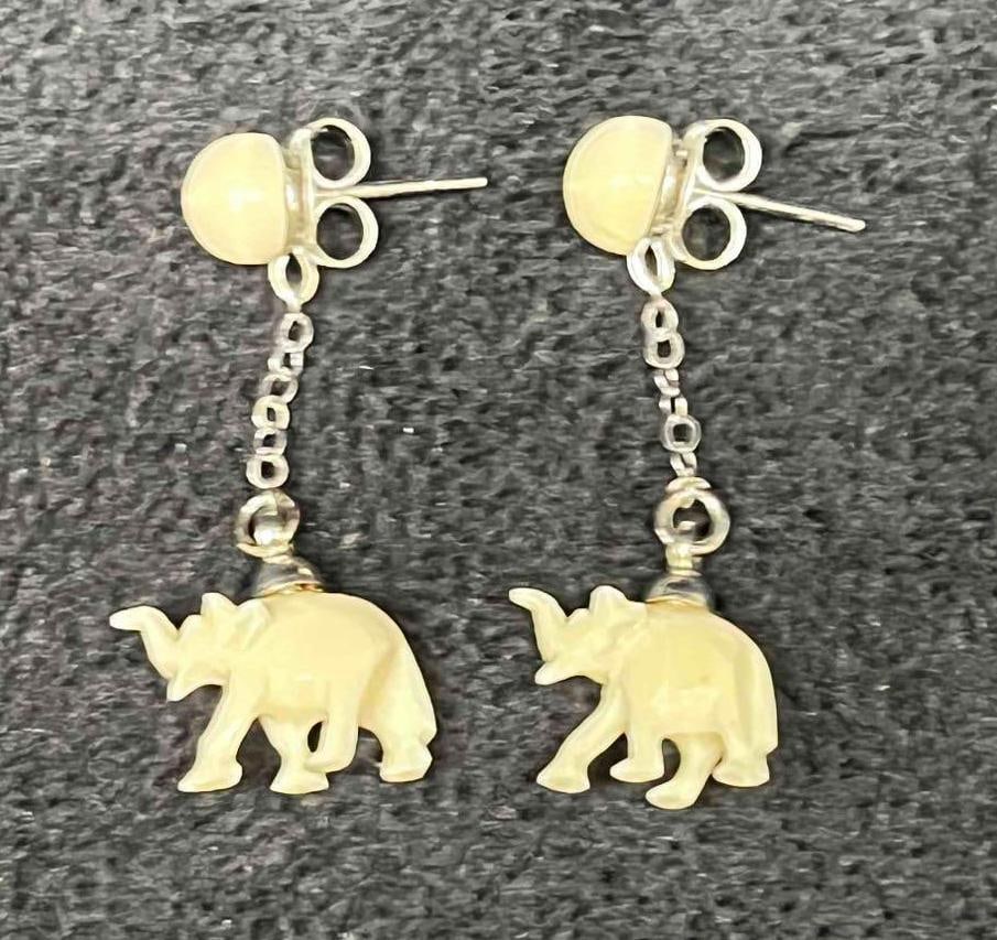 Hand Carved Bone Elephant Dangle Earrings: This lot contains Hand Carved Bone Elephant Dangle Earrings. Each earring is approx 1 1/4" x 3/4" x 1/4". The total weight is less than 1 gram. Overall the Hand Carved Bone Elephant Dangel earrings ar