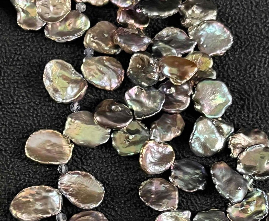 Petal Pearls Peacock Petal Pearl Beads: Petal Pearls Peacock Petal Pearl Beads Pictured are beautiful peacock petal pearls. These pearls have an incredible luster and are in 16" long strands. The pearls are strung on a string and ready 