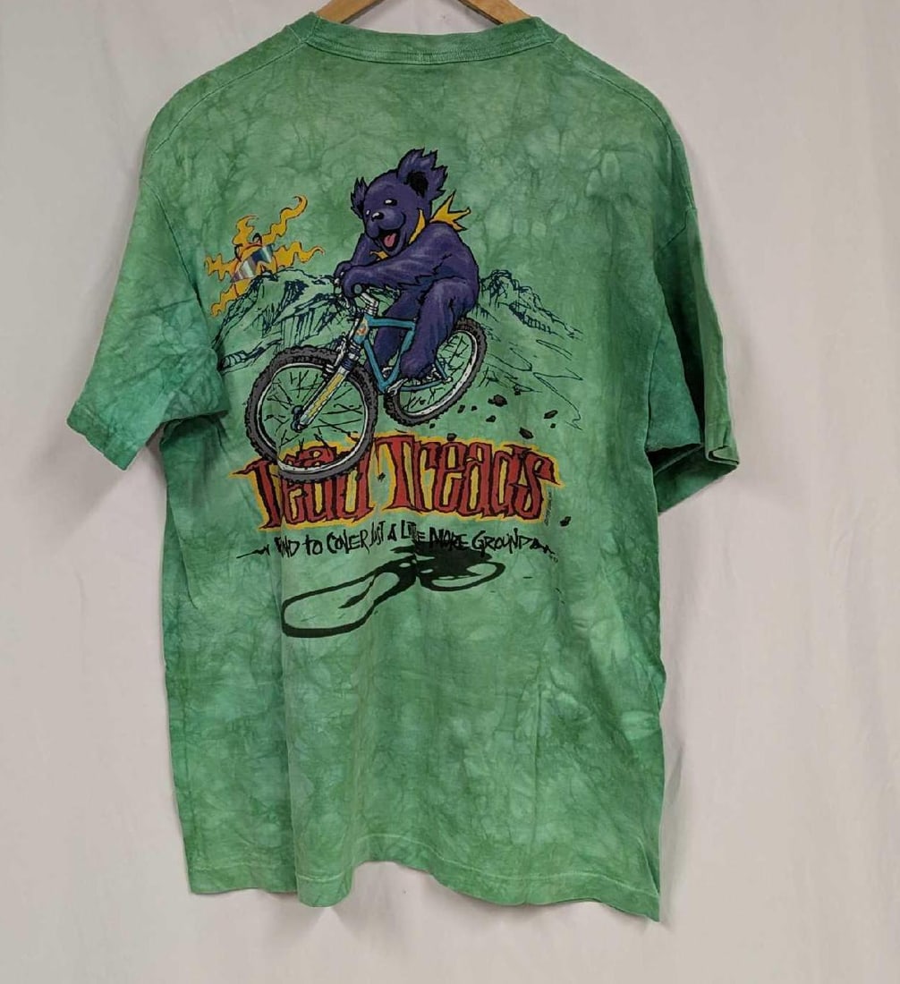 Liquid Blue Grateful Dead Dead Threads Shirt XL: Liquid Blue Grateful Dead Dead Threads Shirt XL. This shirt does not appear to have ever been worn. 100% Cotton. Please note, it does not come with the hanger seen in the image. Folded, the shirt is a