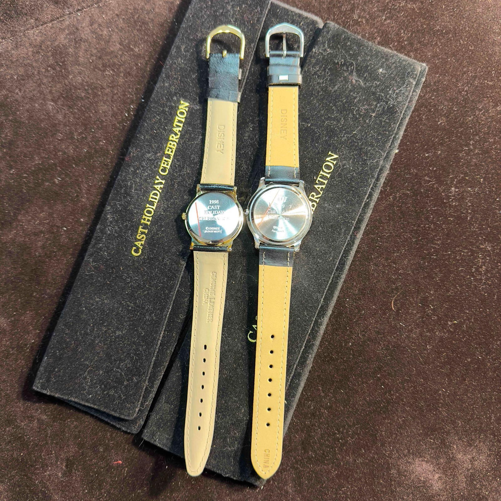 Walt Disney World Cast Holiday Celebration Disney Cast Member Watch Set: Walt Disney World Cast Holiday Celebration Disney Cast Member Watch Set. Both watches feature Mickey and Minnie Mouse. Battery Needs to be replaced. Each watch comes with the original black dust jacke