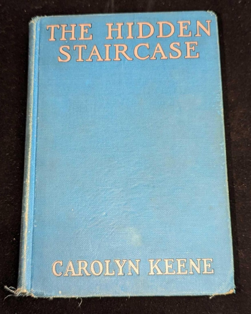 Nancy Drew #2 "The Hidden Staircase" 1930 First Edition: Nancy Drew #2 "The Hidden Staircase" 1930 First Edition. This is approx 5 1/4" x 1" x 7 3/4" and it weighs 0.84lb. The covers have some shelf wear, are missing its dust jacket, and handwriting on the 