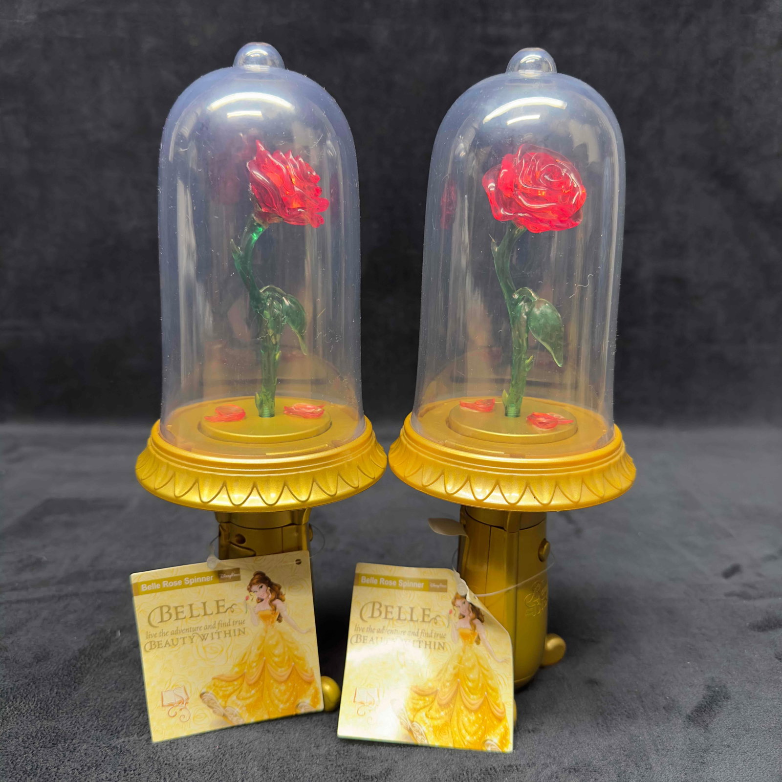 Disney Parks Beauty And The Beast Belle Enchanted Rose Light Up Musical Spinner Set: Disney Parks Beauty And The Beast Belle Enchanted Rose Light Up Musical Spinner Set. Cinderella Bubble Wand. Fallen petals lie at the base of the bell jar that lights-up and spins at the press of a bu
