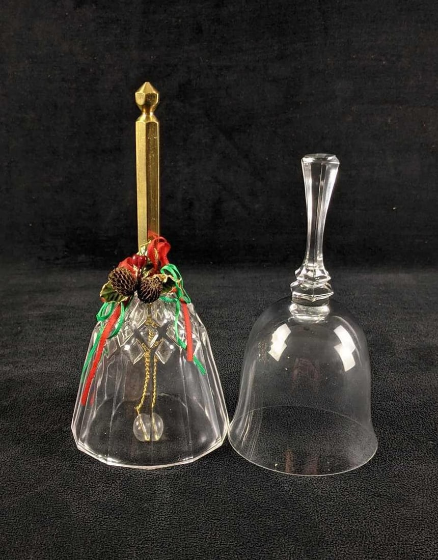Crystal Bells: Crystal Bells Two Crystal bell decorations. One holiday-themed bell Clear bell One has a ringer and the other does not but they are both crystal. Holiday-themed bell is 7in tall Clear Bell is 6in tall