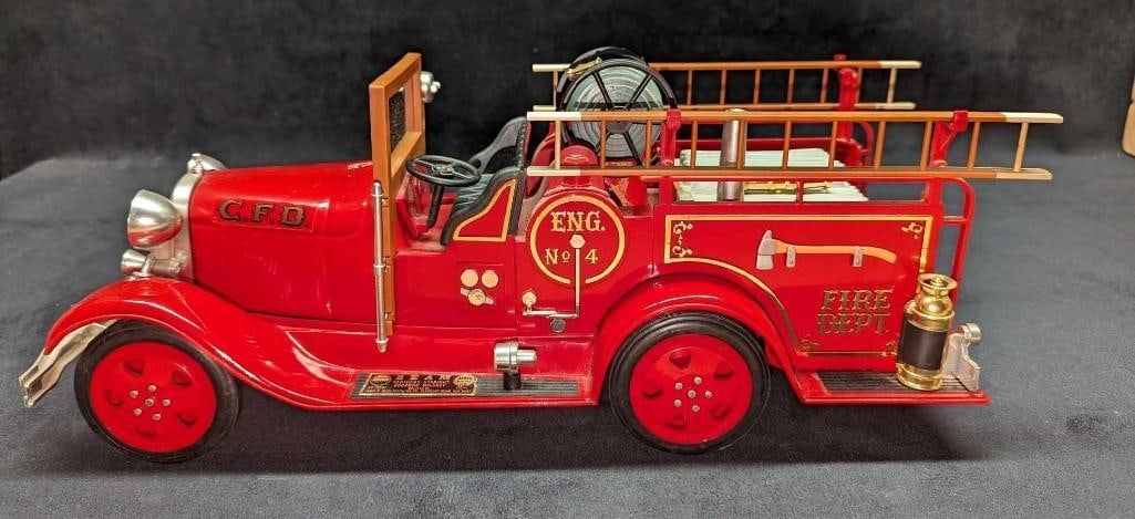 Vintage Jim Beam's Fire Engine Porcelain Decanter: Vintage Jim Beam's Fire Engine Porcelain Decanter. Comes in its original box that is approx 19 1/2" x 8" x 9 1/2" and it weighs 5.80 lbs. The box has shelf wear and tape. The decanter has some signs o