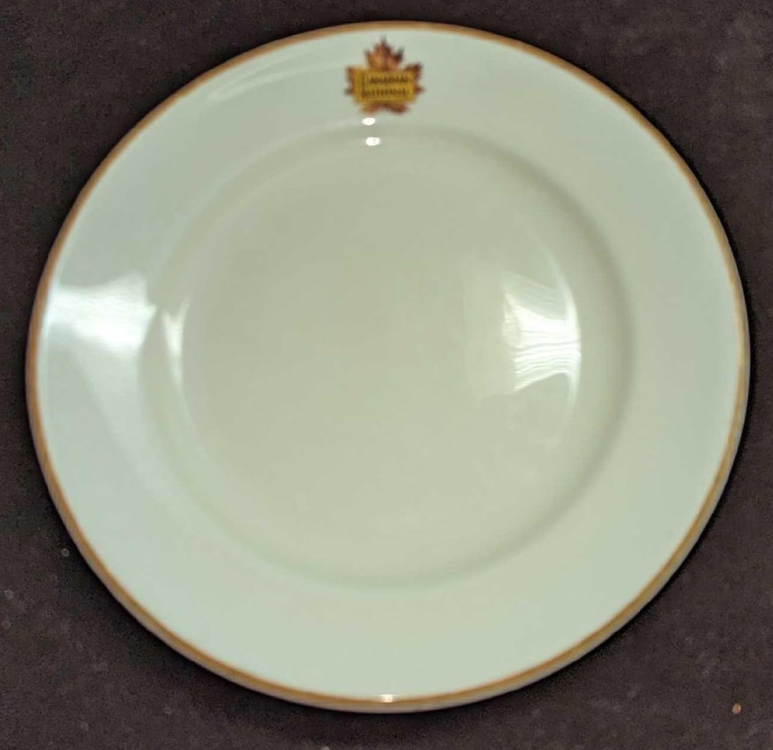 Vintage Canadian National Railways Queen Elizabeth 7" Plate: Vintage Canadian National Railways Queen Elizabeth 7" Plate. This is approx 7 7/8" x 7 7/8" x 3/4" and it weighs 0.85lb. The plate has some scratches and wear on the trim. This bone china plate was by