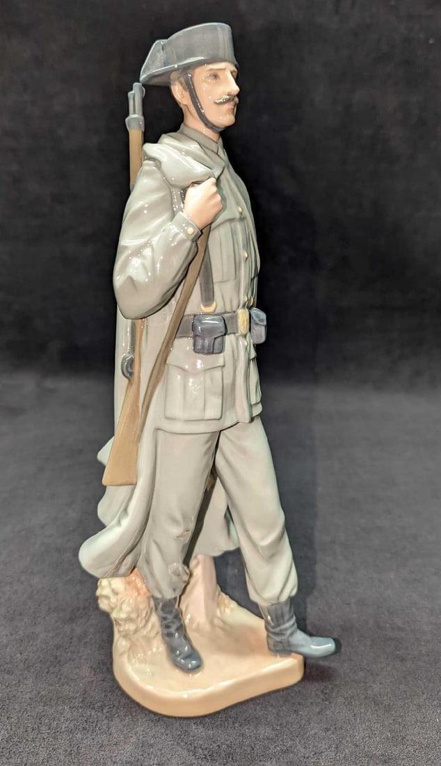 Retired Lladro Spanish Policeman Figurine: Retired Lladro Spanish Policeman Figurine. This was designed by Salvador Furio and was released in 1974. This figurine is approx 5" x 3" x 11 1/2" and it weighs 1.19lb. The figurine has no chips 