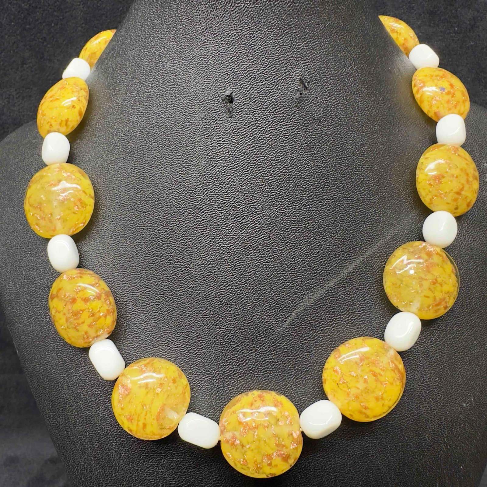 Venetian Murano Lamp Work Glass Art Yellow Circle Copper Accent Beaded Necklace E78: Venetian Murano Lamp Work Glass Art Yellow Circle Copper Accent Beaded Necklace E78. Necklace with yellow colored glass beads with a beautiful design on each. The necklace features copper colored acce