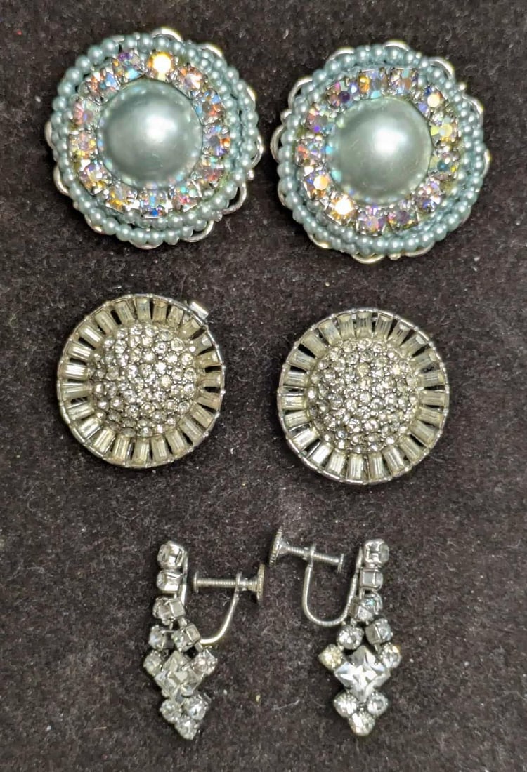 3 Sets Of Weiss Coro Clip On Silver Tone Earrings: 3 Sets Of Weiss Coro Clip On Silver Tone Earrings. This lot includes: (1) Set Of Weiss Round Silver Tone Baquette Rhinestone Clip On Earrings. Each is approx 1" x 1" x 1/2". (1) Set Of Un