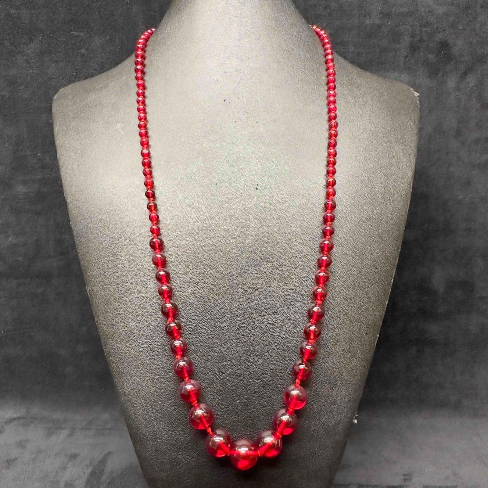 Cherry Red Crystal Glass Round Beaded Costume Jewelry Necklace H32: Cherry Red Crystal Glass Round Beaded Costume Jewelry Necklace H32. Necklace with red colored round glass beads. The necklace features a spring ring clasp closure. This item is in good pre-owned, prev