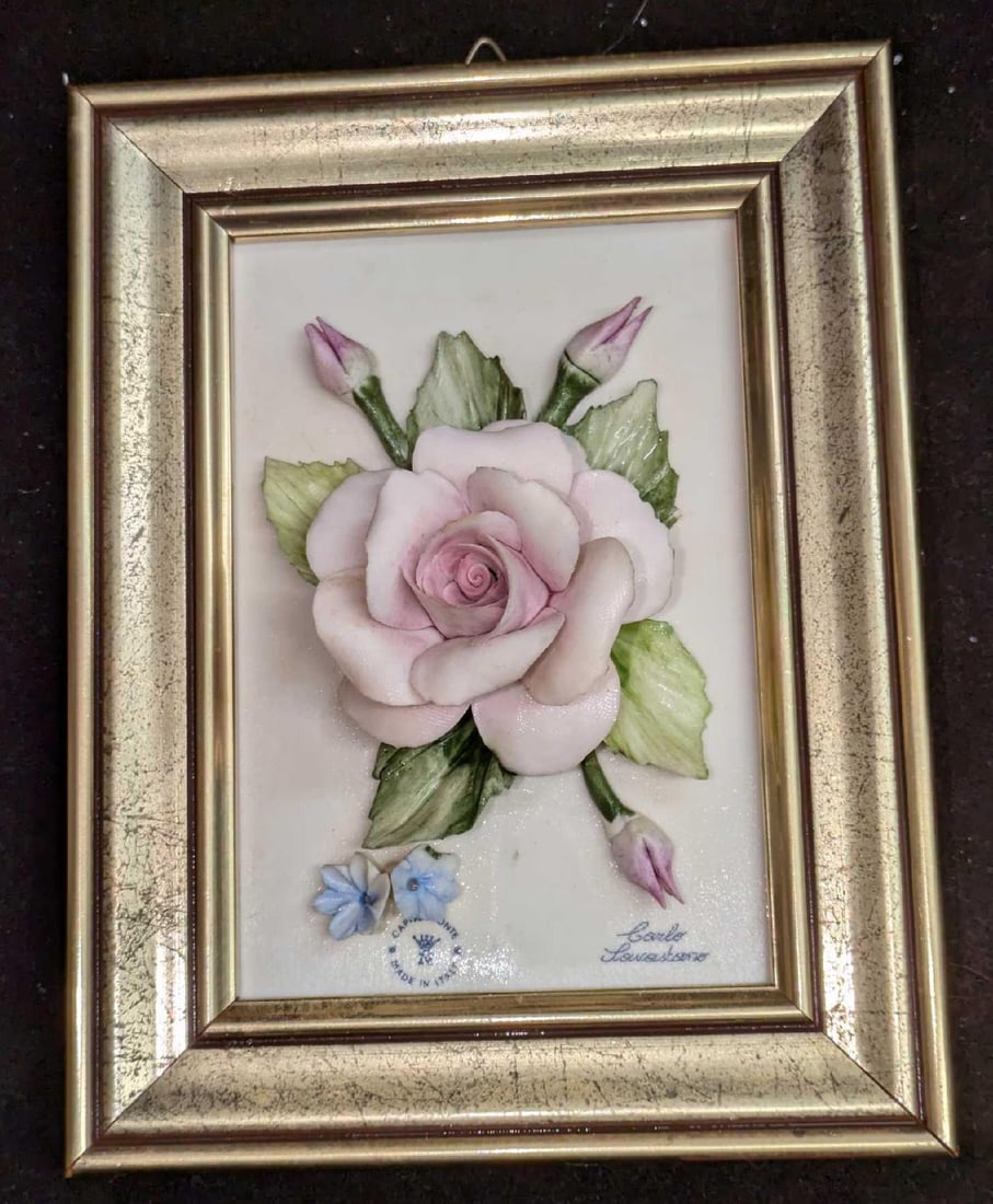 Framed Carlo Savastano Capodimonte Rose Figurine: Framed Carlo Savastano Capodimonte Rose Figurine. This was made it Italy. This is approx 5" x 2" x 6 3/4" and it weighs 0.86lb. This has some markings and very small chips on the petals. 