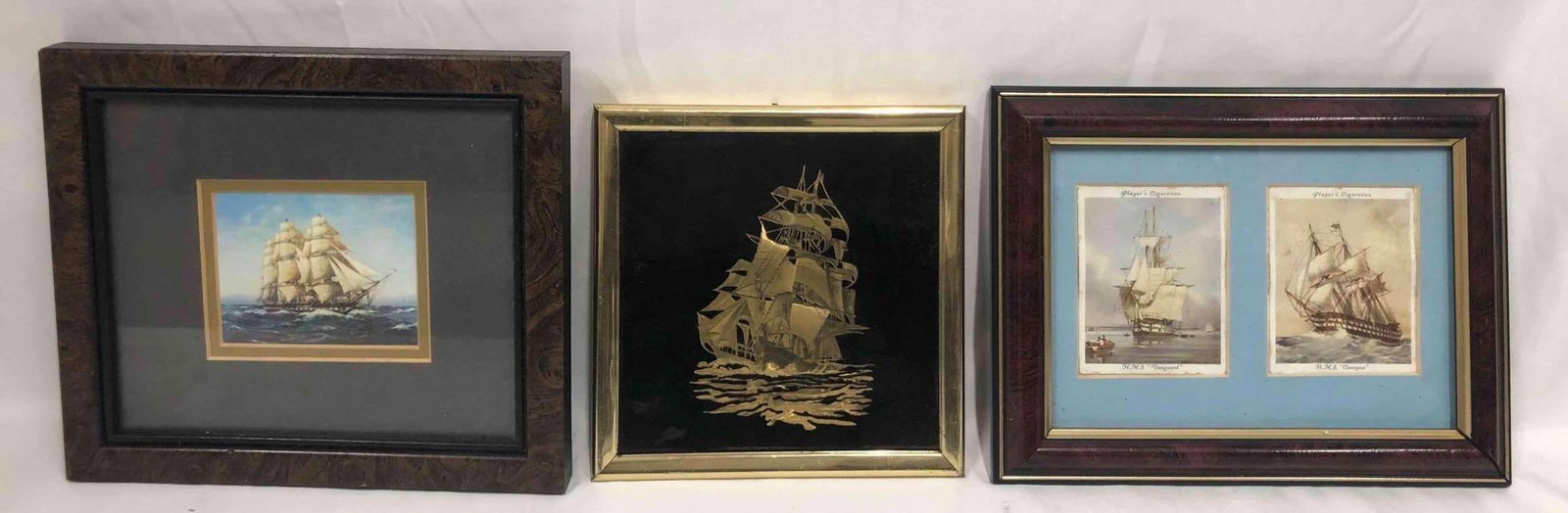 Bundle Of Ship Artwork In Frames: This lot contains a bundle of three different artworks all depicting ships. The ship with the gold frame is approx 6" x 6 1/4", The two named ships are approx 6 1/2" x 8 1/2" and the last one is appro