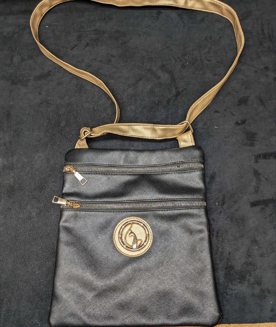 Baby Phat Shoulder Black Bag: Baby Phat Shoulder Black Bag. With gold tone company logo with what appears to be rhinestones. This is approx 9 3/4" x1/4" x 11" and it weighs 0.50lb. The bag has light wear and the inside has s