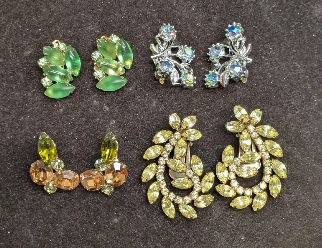 Vintage Coro And Unmarked Gold Silve Tone Rhinestones Clip On Earrings: Vintage Coro And Unmarked Gold Silve Tone Rhinestones Clip On Earrings. This lot includes: (1) Set Of Unmarked Gold Tone Green Rhinestone And Glass Beaded Clip On Earrings. Each is approx 1" x 3/