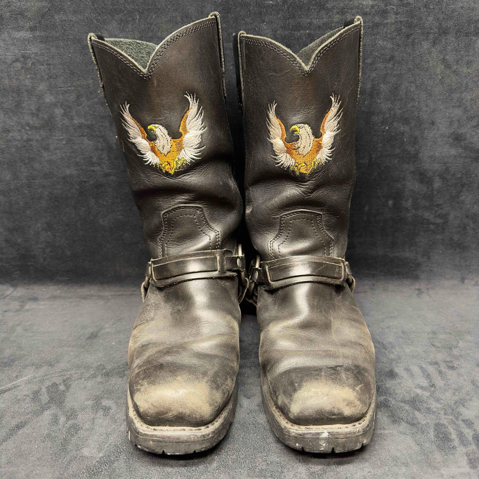 Xelement Men's Motorcycle Biker Riding Eagle Logo Black Leather Boots Size 10.5: Xelement Men's Motorcycle Biker Eagle Logo Black Leather Boots Size 10.5. Genuine leather black boots and eagle logo. Light wear noticed near front top toe area, Scuffed up, and boot sole bottoms