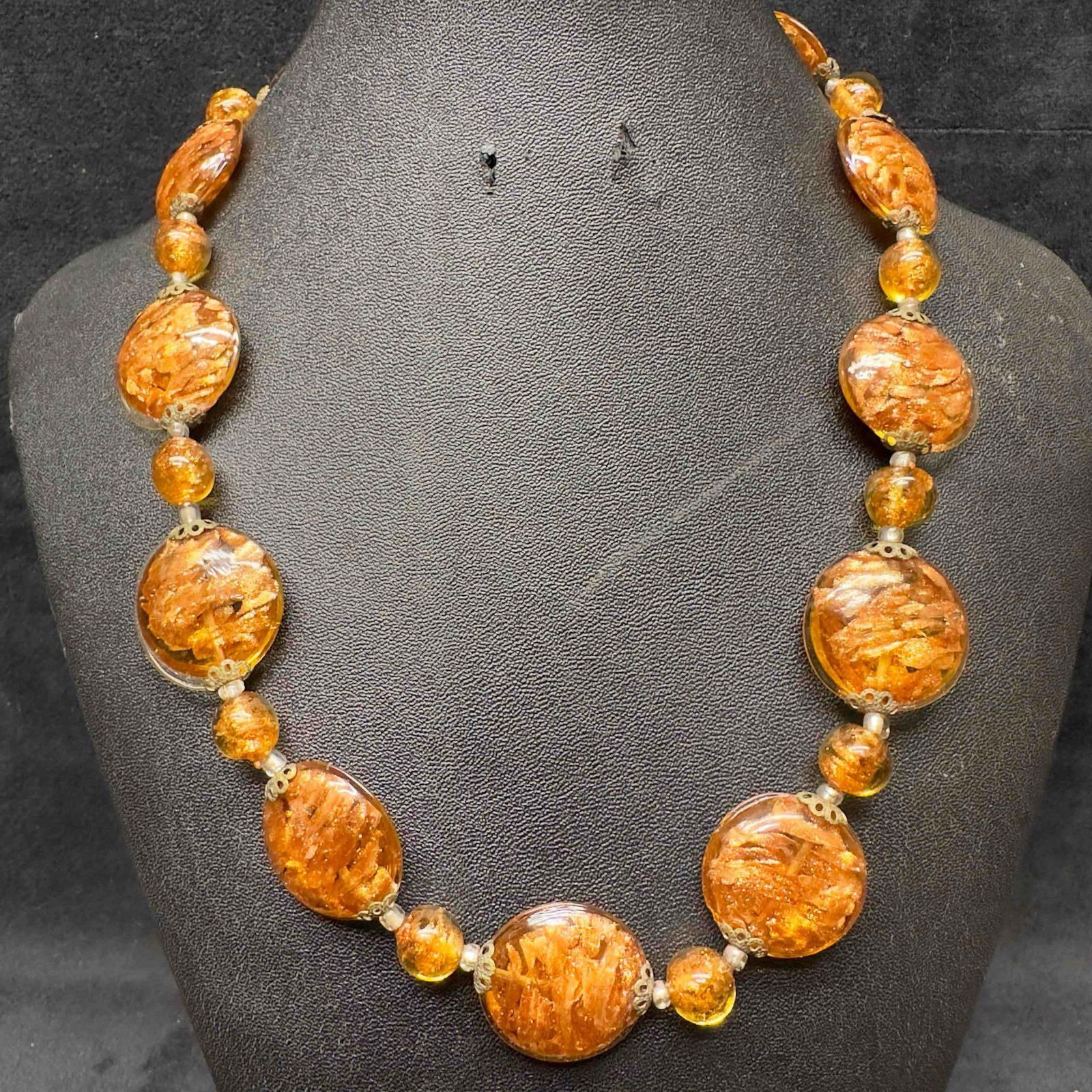 Venetian Murano Lamp Work Art Glass Brown Copper Circle Beaded Necklace C41: Venetian Murano Lamp Work Art Glass Brown Copper Circle Beaded Necklace C41. Necklace with brown colored glass beads with beautiful designs on each. The necklace features copper colored accents. The n