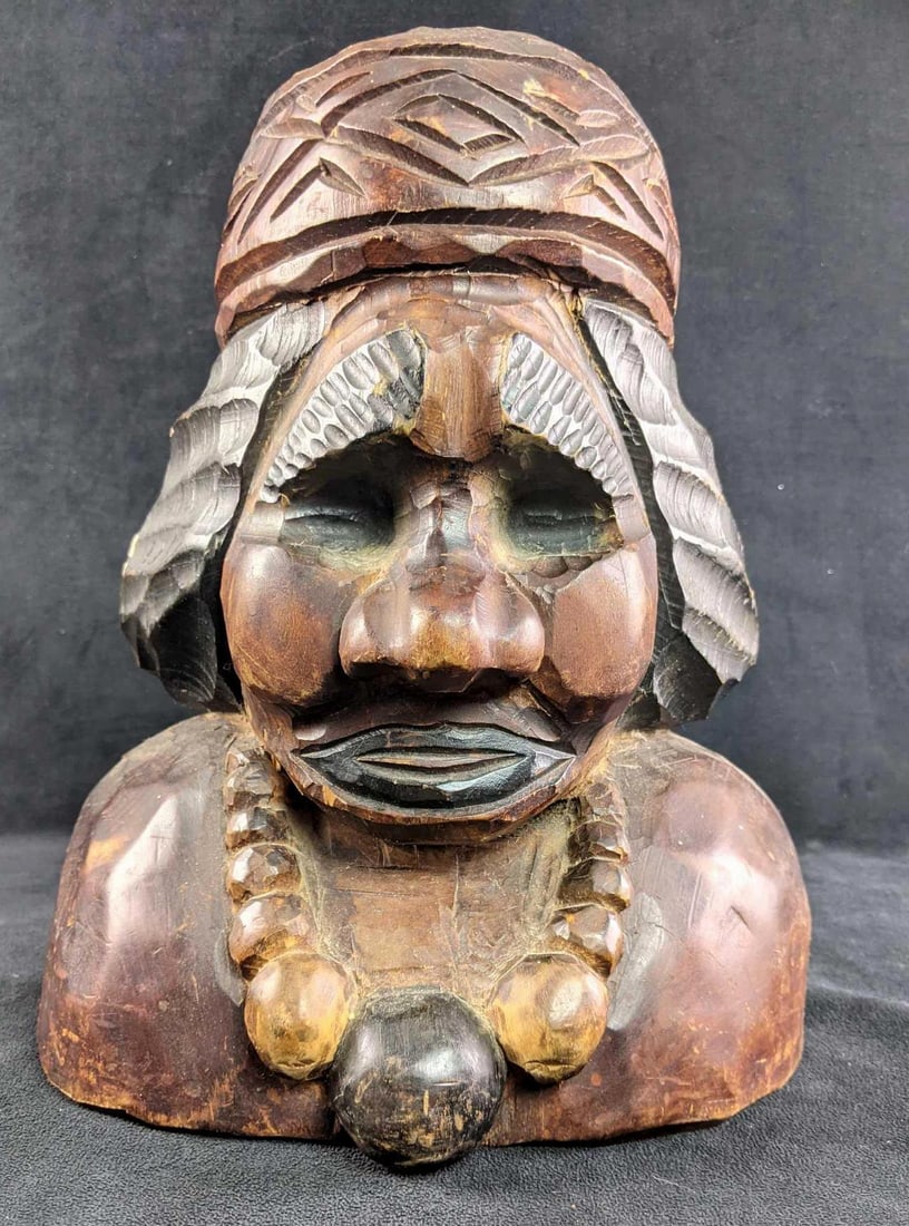 Wood Carved Bust Sculpture: Wood Carved Bust Sculpture This carved bust is in great condition, there are some paint marks on one side of the piece. This looks to be a bust of an important figure from a tribe. This is an overall 