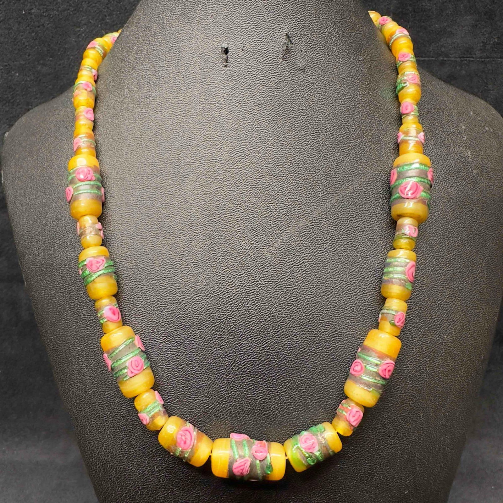 Venetian Murano Lamp Work Art Glass Bead Yellow Floral Pink Green Accents Beaded Necklace C46: Venetian Murano Lamp Work Art Glass Bead Yellow Floral Pink Green Accents Beaded Necklace C46. Necklace with yellow colored glass beads with beautiful designs on each. The necklace features floral acc