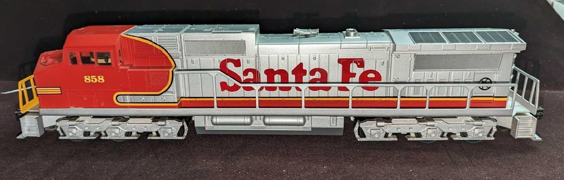 Williams By Bachmann Dash 9 Powered Locomotive #858: Williams By Bachmann Dash 9 Powered Locomotive #858. This is approx 17 1/2" x 3 1/2" x 3 1/2". This comes in its original box that is approx 19" x 4 1/2" x 5 1/2" and it weighs 5.48lb. The box has som