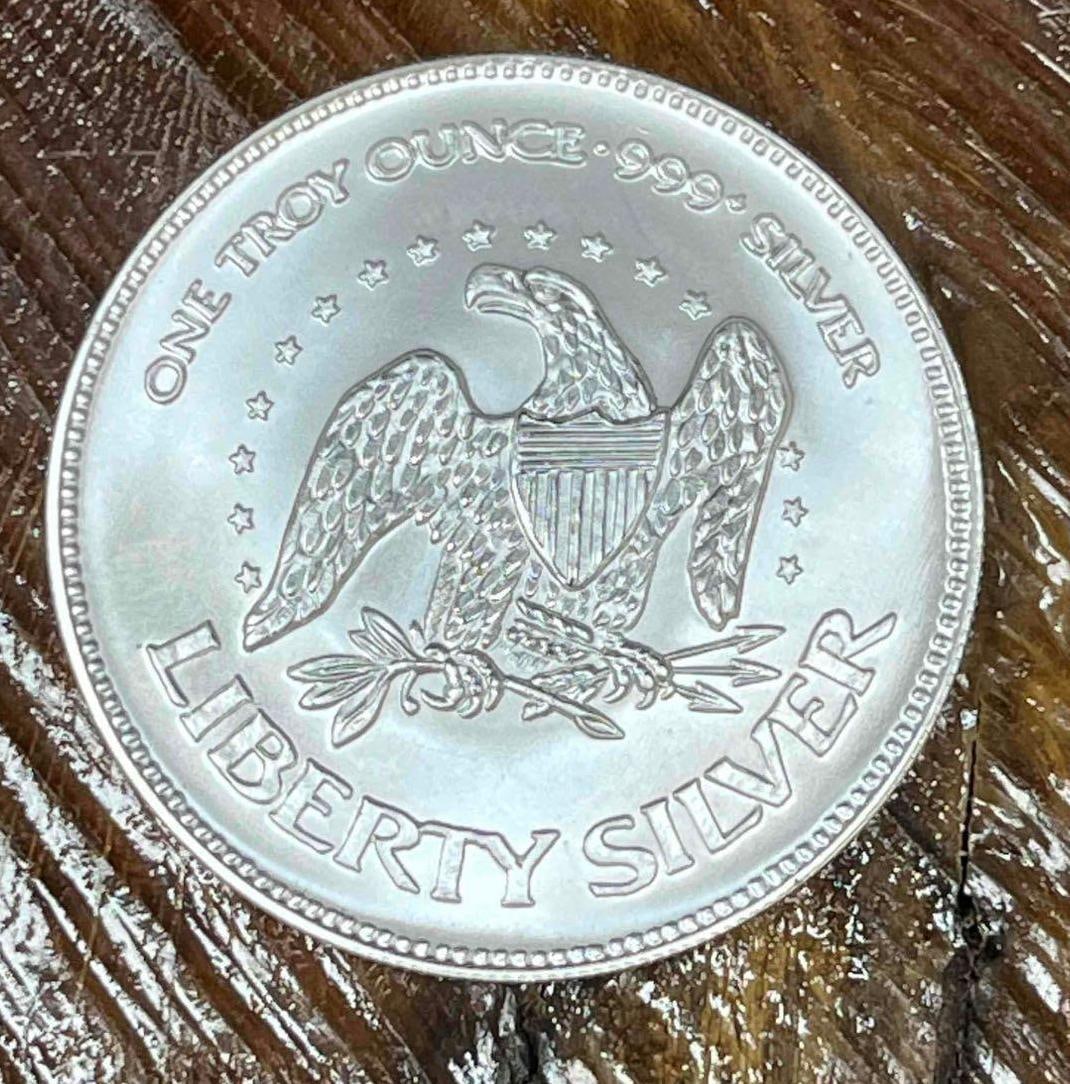 .999 Fine Silver A-Mark Liberty 1oz Bullion Round (F): This Round has been tested and researched to the best of our ability prior to listing. Please view photos, as they are a part of the condition. DETAILS: Metal - .999 Fine Silver Tested - Yes Size - 38