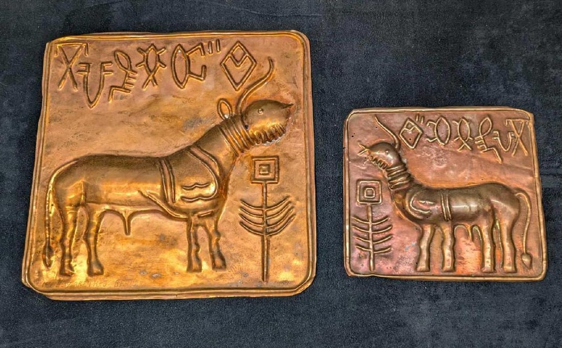 Two Vintage Indus Valley Sacred Bull Copper Reliefs: Two Vintage Indus Valley Sacred Bull Copper Reliefs. The larger is approx 11" x 3/4" x 10 3/4". The smaller is approx 7 1/4" x 3/4" x 6 1/2" and the total weight is 0.70lb. The larger is marked, "Ms E
