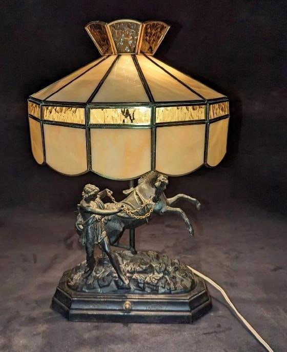 Vintage Ancien Cavalier Metal Table Lamp: Vintage Ancien Cavalier Metal Table Lamp. This is approx 10 1/2" x 5 1/2" x 17 1/2" and it weighs 7lbs. The lamp is made of light metal and does not come with a lampshade. Was tested and it works. The