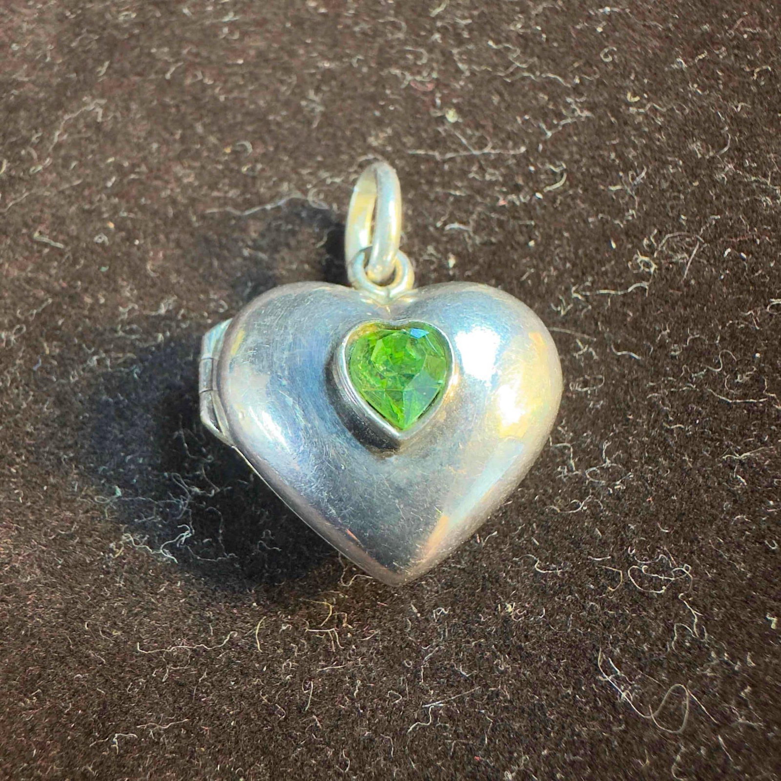 Sterling Silver Heart Green Gem Locket Pendant: This piece of jewelry has been tested and researched prior to listing. Please view all our pictures as they are part of our description. DETAILS: Metal - Sterling Silver Color - Silver Stones - Yes Ha