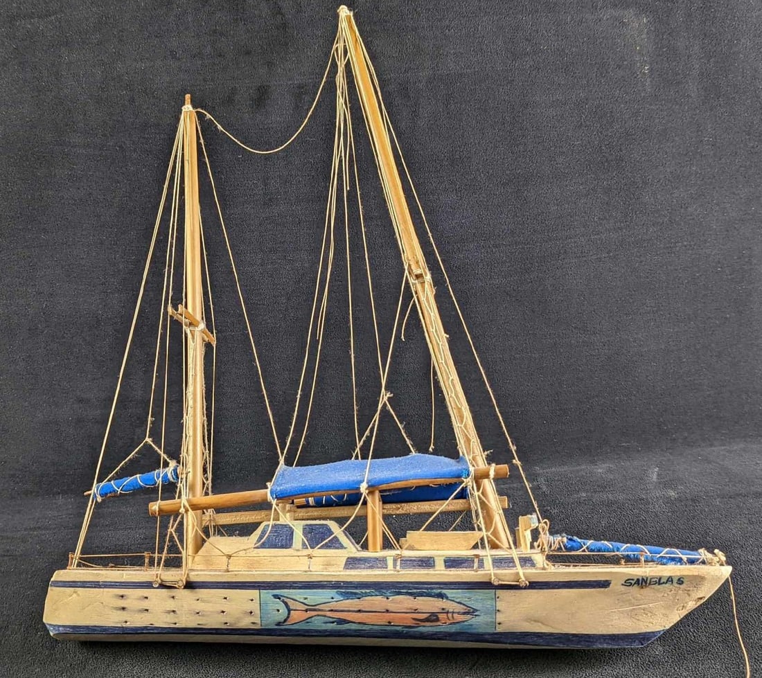 Vintage Hand Carved Balsa Wood Ship Model: Ship Model, Pilot House Ketch "San Blas"; this is a carved balsa wood model. The model is named San Blas which leads us to believe it is a souvenir from a vacation to the islands of Panama. It is in g