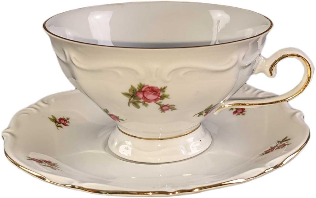 Bavaria Western Germany Pink Roses Cups & Saucers: This lot includes: (4) Saucers. These are approx 6". Two of the saucers have chips. (3) Cups. These are approx 5" x 4" x 2 1/2". One of the cups has a chip on the rim.