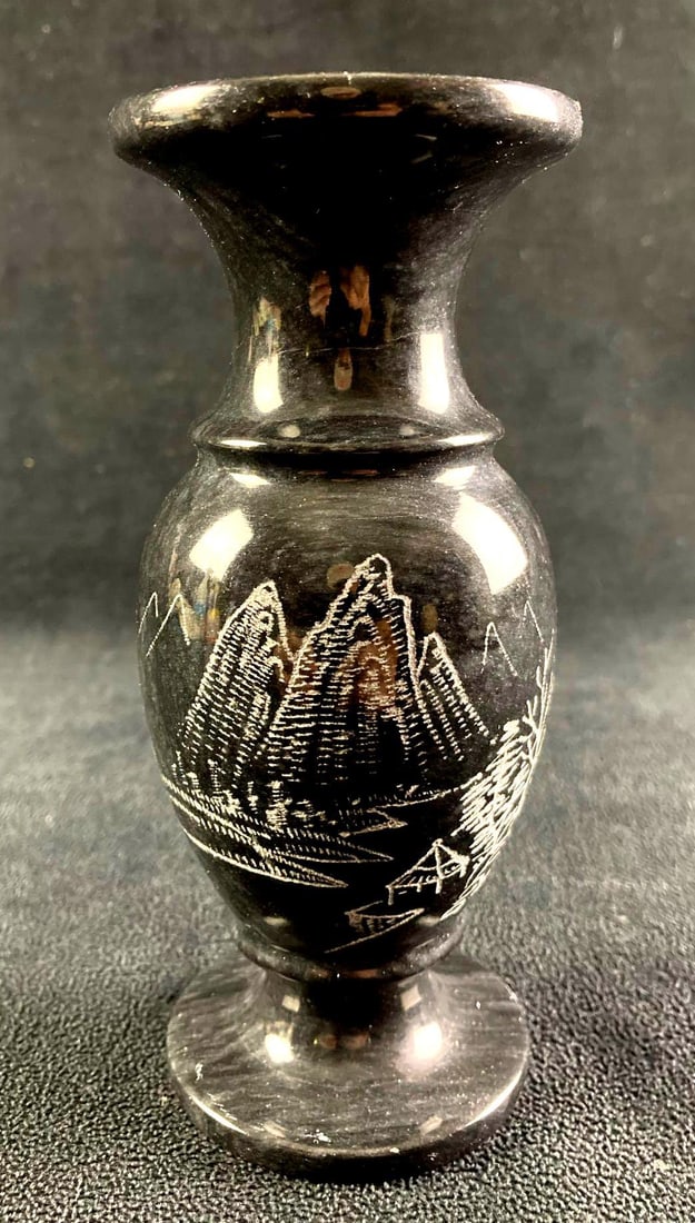 Stone Vase Etched Mountain Scene: This lot includes: (1) Stone Vase Etched Mountain Scene Condition is used and see photographs for additional details. The stone vase is light black in color and has an et