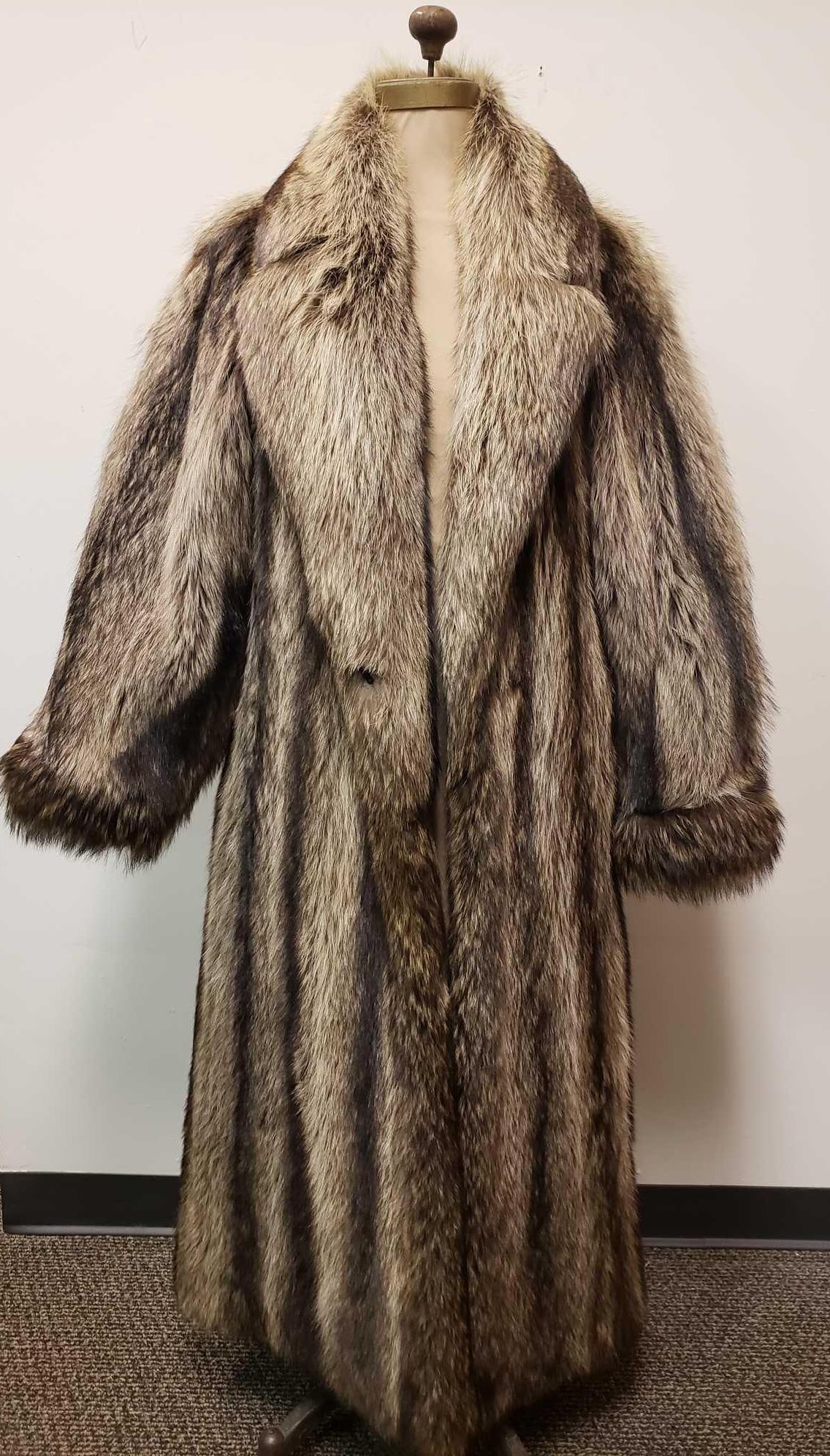 Chas A Stevens and Co Authentic Raccoon Fur Coat: Chas A Stevens and Co Authentic Raccoon Fur Coat. This fur coat is in great used condition. There are no known signs of damage to the interior or exterior of the coat. The opening has a 3 hook and loo