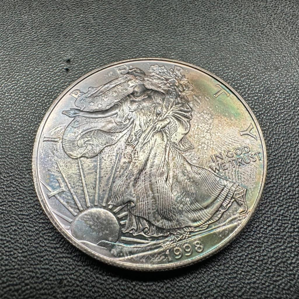 Toned .999 Silver American Silver Eagle Coin 1998: These coins have been tested and researched to the best of our ability prior to listing. Please view photos, as they are a part of the condition. DETAILS: Metal - .999 Pure Silver Tested - Yes Size -