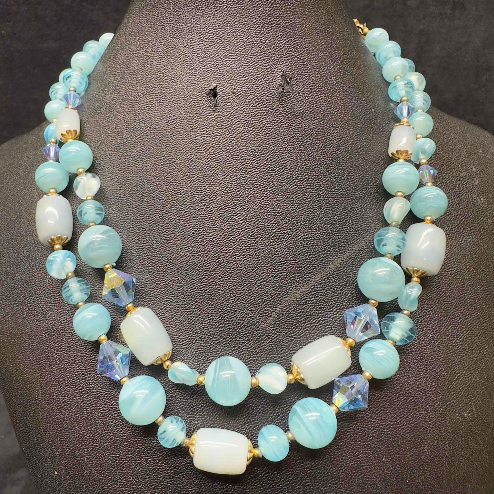 Murano Venetian Lamp Work Art Glass Light Sky Blue Double Layer Beaded Necklace F65: Murano Venetian Lamp Work Art Glass Light Sky Blue Double Layer Beaded Necklace F65. Necklace with light blue colored glass beads with a beautiful design on each. The necklace features gold toned acce