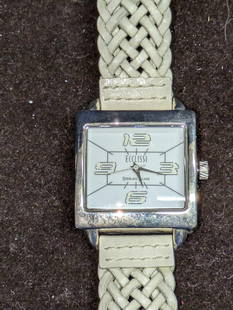 Ecclissi Sterling Silver Watch With Leather Braided Band A: Ecclissi Sterling Silver Watch With Leather Braided Band A. Sterling Silver Case And Stainless Steel Case. Has Japanese Movement. Is approx 1 1/4" x 1/4" x 9" and it weighs 0.05lb. Both the band and c