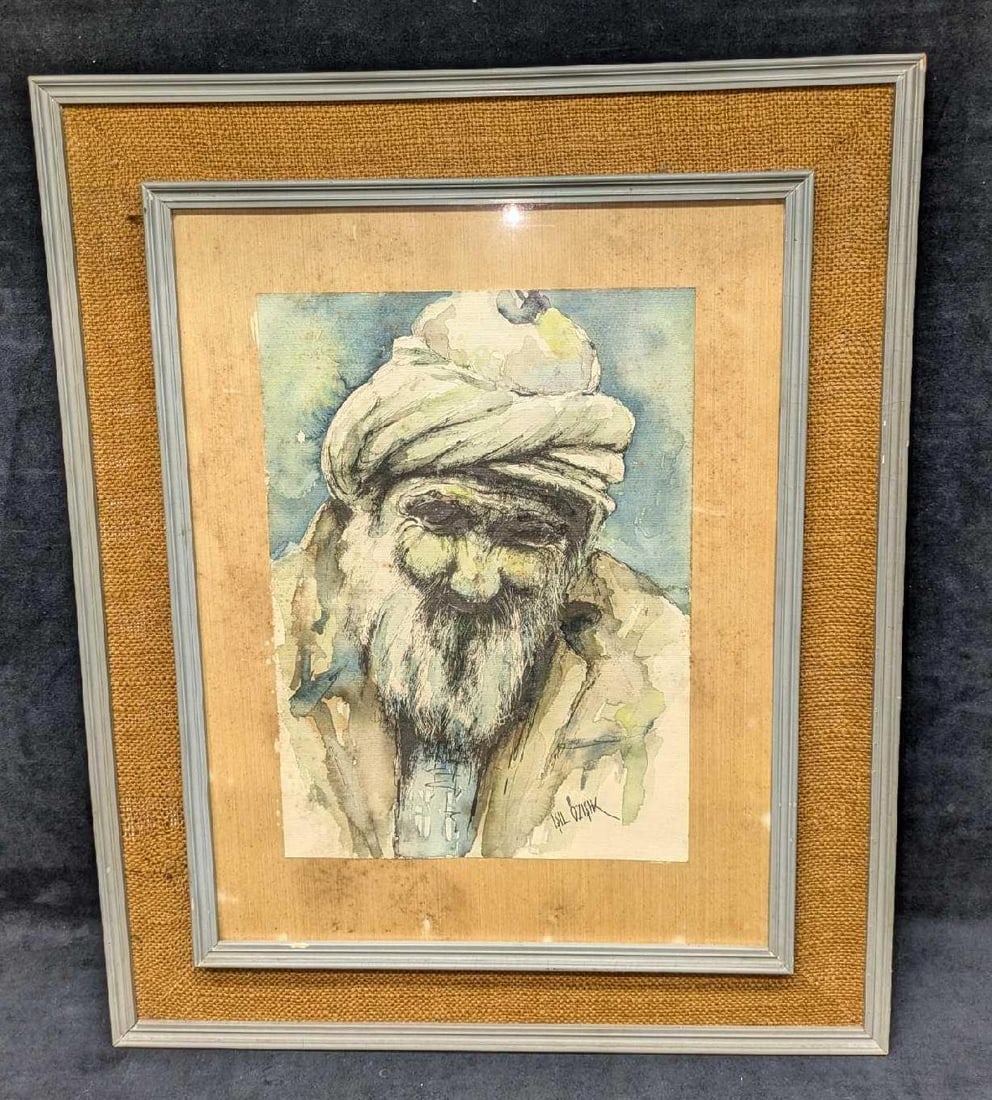 Original Isil Ozisik Watercolor Man With Turban: Original Isil Ozisik Watercolor Man With Turban. This is approx 19 1/4" x 3/8" x 23 1/2" and it weighs 5lbs. There are some chips on the frame. I??l Öz???k was born in K?rklareli in 1939.