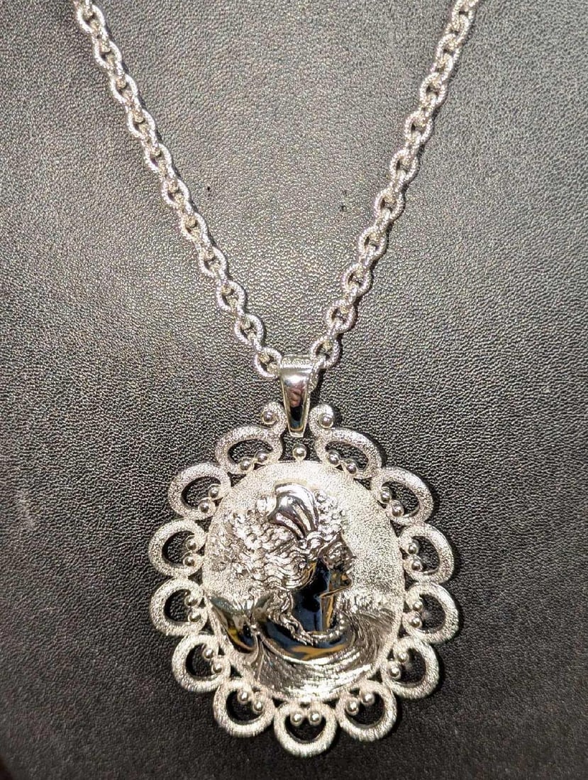 Vintage Trifari Silvertone Cameo Pendant Necklace: Vintage Trifari Silvertone Cameo Pendant Necklace. The chain is approx 20 1/2" and the pendant is approx 2 1/4" x 1/4" x 2 3/4". It weighs 0.12lb. 