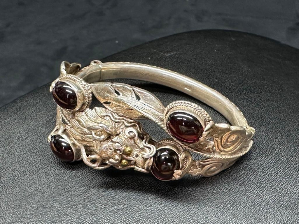 Nepali Sterling Garnet Dragon Hinged Bracelet: This piece of jewelry has been tested and researched prior to listing. Please view all our pictures they are part of our description. DETAILS: Metal - Sterling Silver Color - Silver Stones - Garnet Ha