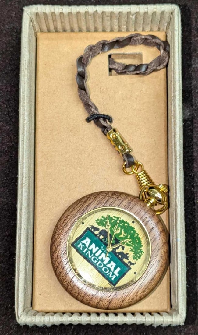 Nature's Time Disney Animal Kingdom Wooden Pocket Watch: Nature's Time Disney Animal Kingdom Wooden Pocket Watch. This was originally given to Disney Cast Members. This was never used and it comes in the original box still attached. The box is approx 5 1/2"