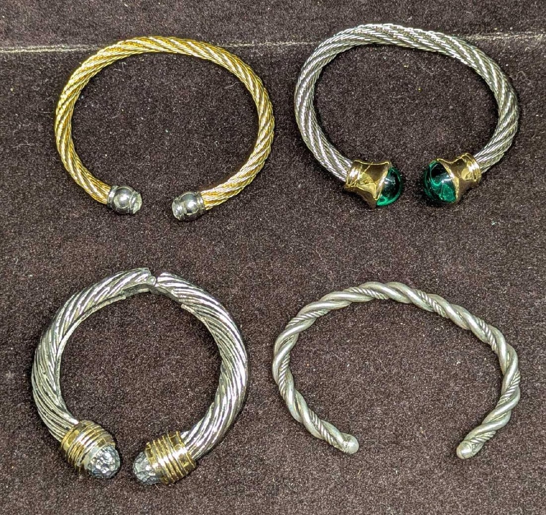 4 Vintage Gold Silver Tone Cuff Bracelets: 4 Vintage Gold Silver Tone Cuff Bracelets. These do not have any maker or company markings. Comes in a bag that is approx 2 3/4" x 1" x 4 1/2" and it weighs 0.28lb. 