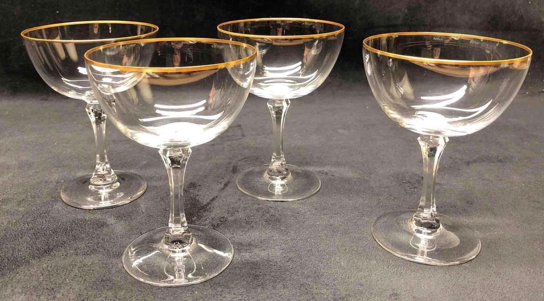 Lenox "Mansfield" Crystal Gold Rim Champagne Glasses: This lot contains a Set of 4 Lenox "Mansfield" Gold Rim Crystal Champagne Glasses. Each glass is approx 5-1/4" tall with 5" diameter. Combined weight for the set of 4 glasses is about
